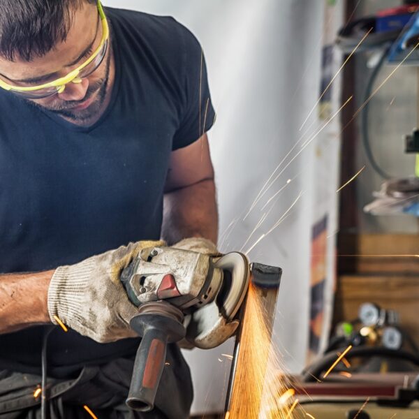 man using a grinding tool